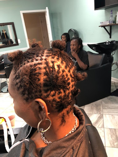A woman getting her hair done in a salon